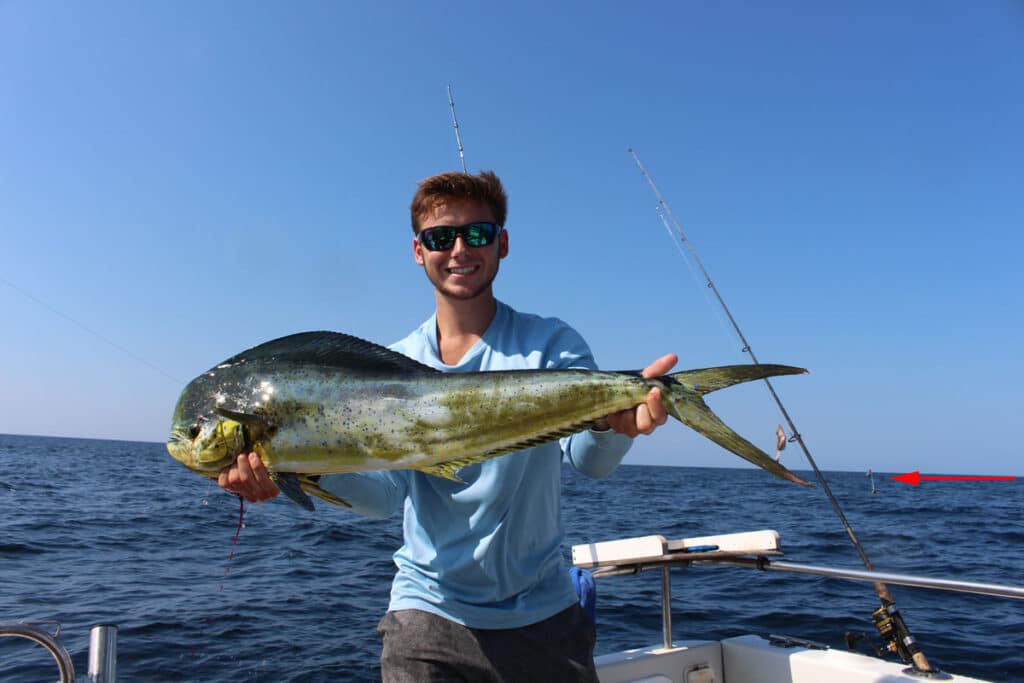 Man holding mahi-mahi